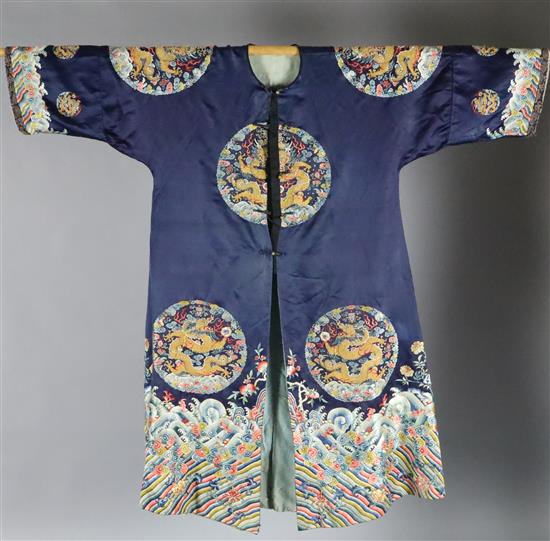 A Chinese noblewomans embroidered silk midnight blue surcoat (longgua), late 19th century, 138cm long, minor alterations to sleeves an